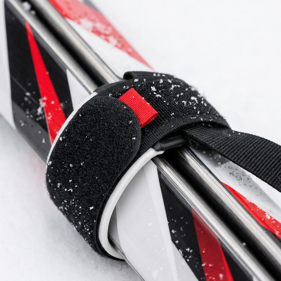 The hook-and-loop strap around skis and poles